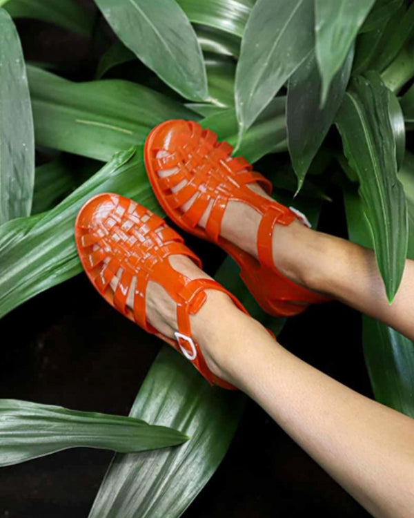 model wearing the Sun Jelly Sandals in Flame