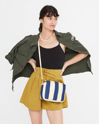 Danica wearing the Indigo & Cream Woven Racing Stripes Marisol crossbody