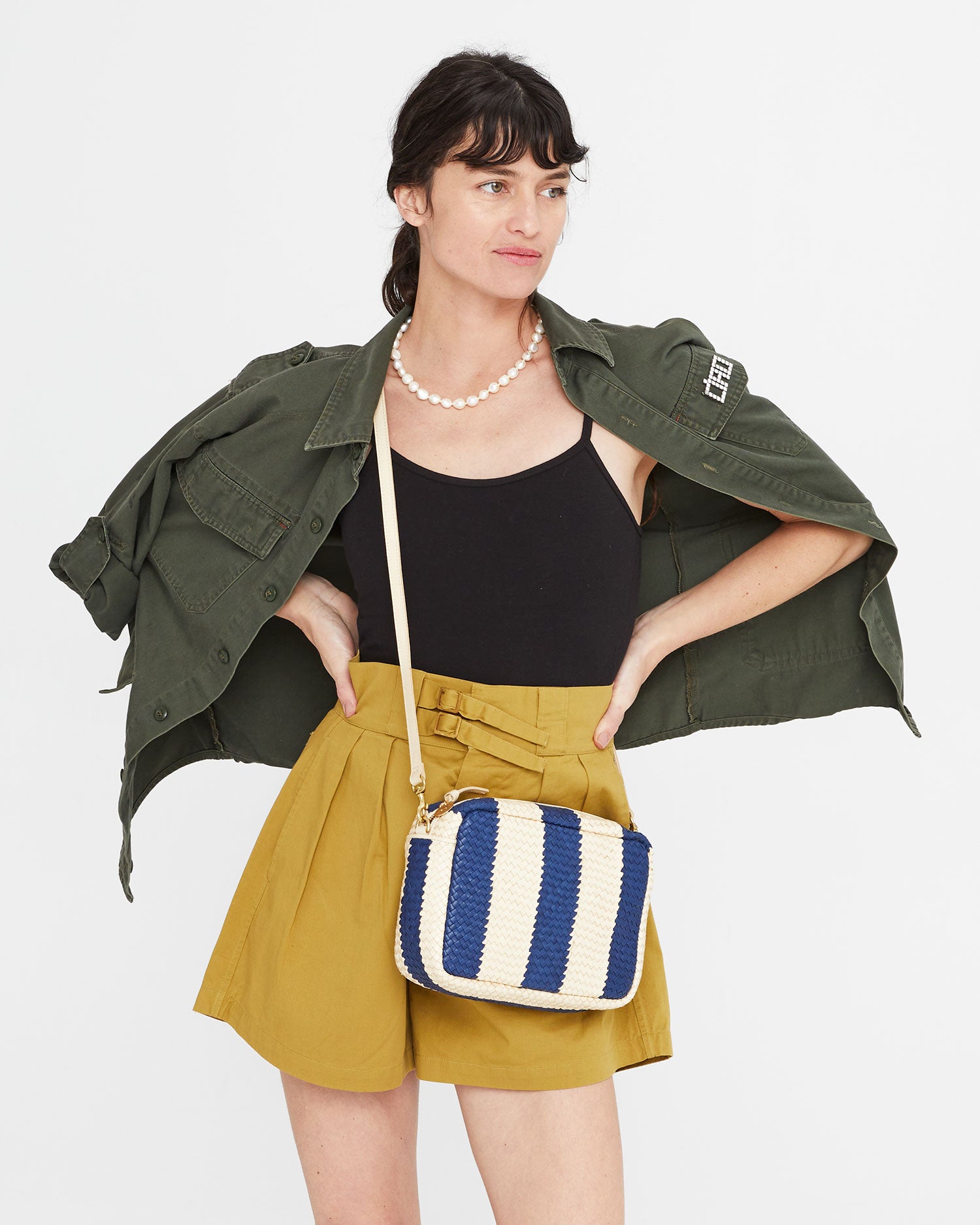 Danica wearing the Indigo & Cream Woven Racing Stripes Marisol crossbody