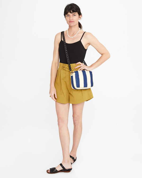 Danica wearing the Indigo & Cream Woven Racing Stripes Marisol crossbody with the black link crossbody strap