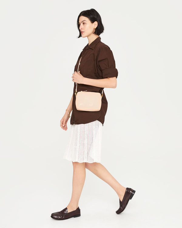 Athena wearing the Ballet Perf Midi Sac crossbody