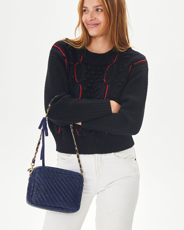 aurelia with her arms crossed with the Pacific Woven Zig Zag Midi Sac and grosgain in chain shoulder strap