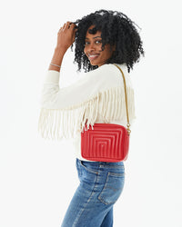Mecca wearing the Rouge Channel Quilted Midi Sac on her shoulder with the thick chain shoulder strap
