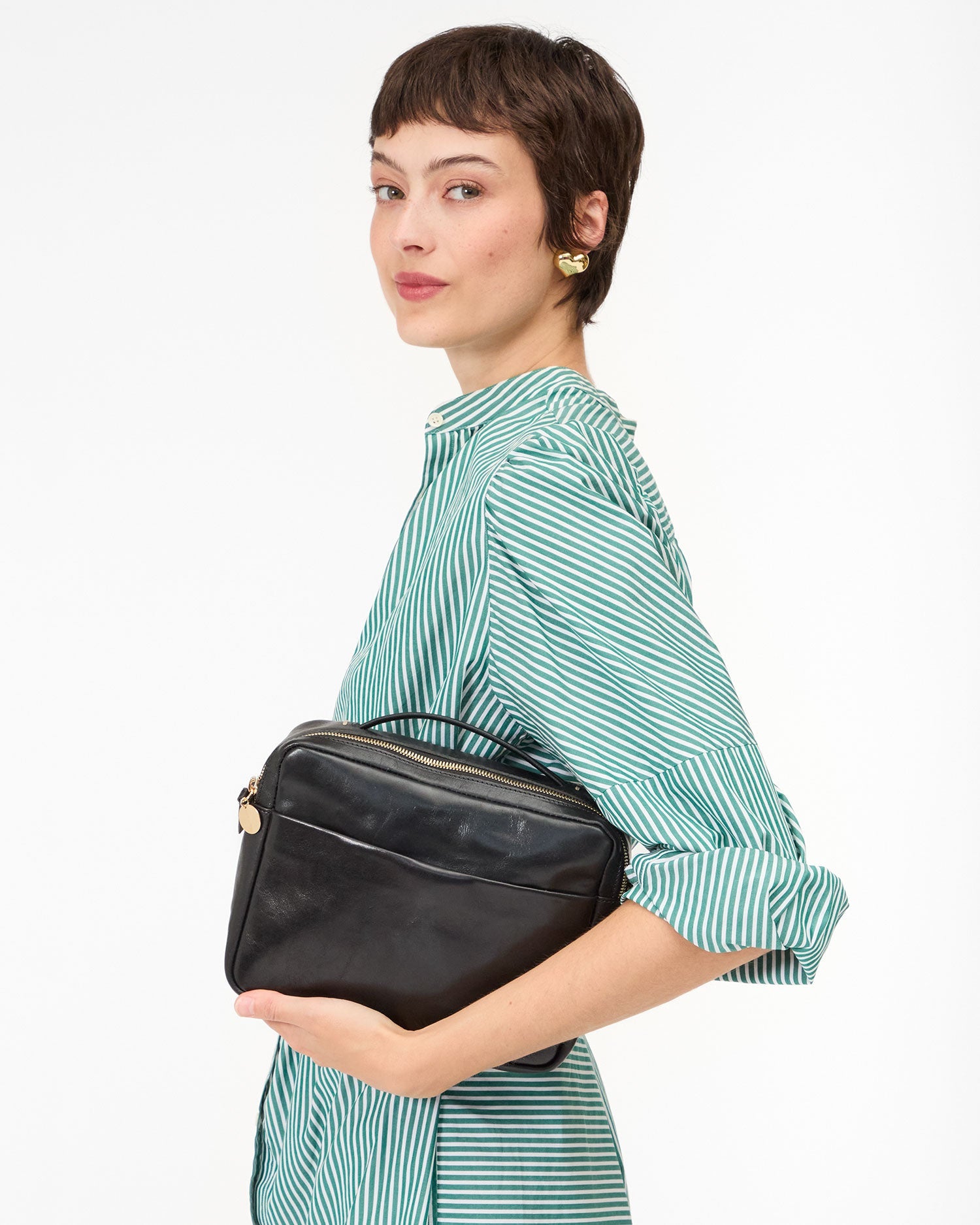 Nike holds Black Mirabel side pose