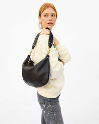 Haley wearing the Black Moyen Messenger as a Shoulder Bag