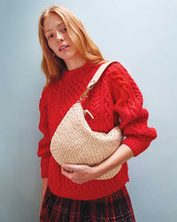 Haley Wearing the Cream Woven Checker Moyen Messenger on her shoulder
