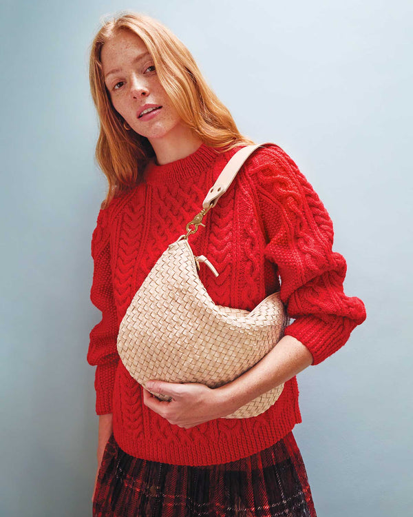 Haley Wearing the Cream Woven Checker Moyen Messenger on her shoulder