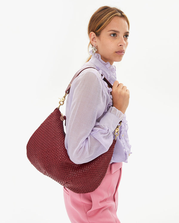 Aurelia with the Oxblood Diagonal Woven Moyen Messenger on her shoulder