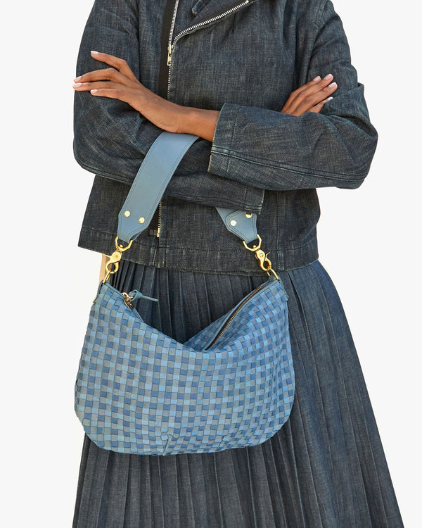 jordan with her arms crossed with the Jean Similaire Woven Checker Moyen Messenger hanging off by its shoulder strap