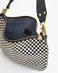 Interior View of Moyen Messenger in Black and Cream Woven Checker