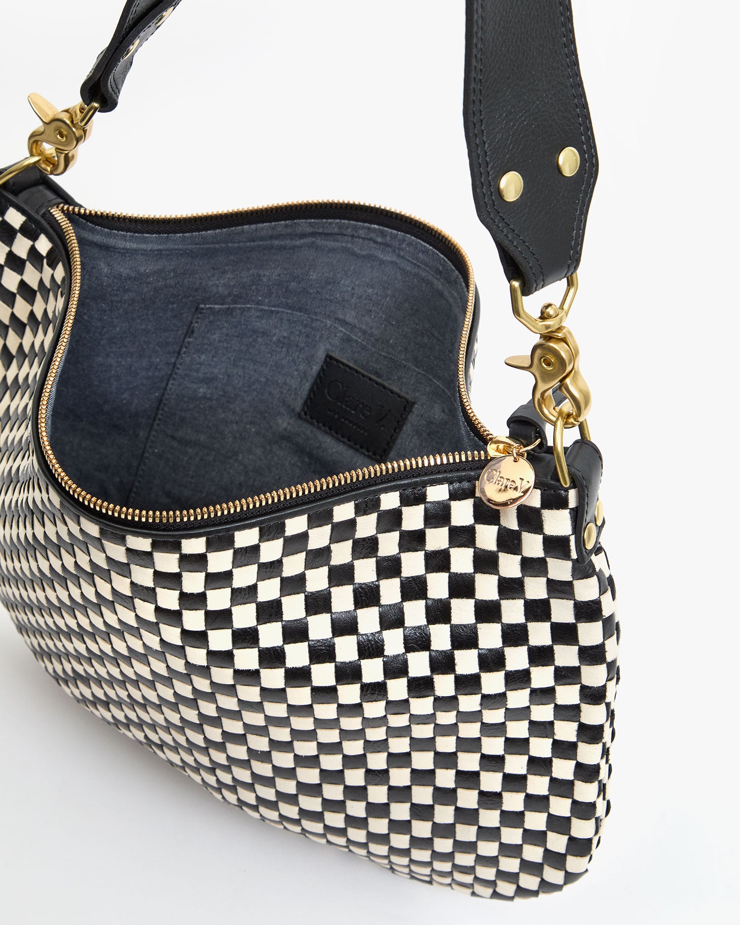 Interior View of Moyen Messenger in Black and Cream Woven Checker