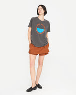athena wearing the  original tee faded black with bright poppy st calais blue maison bourgneuf with a rust colored skort
