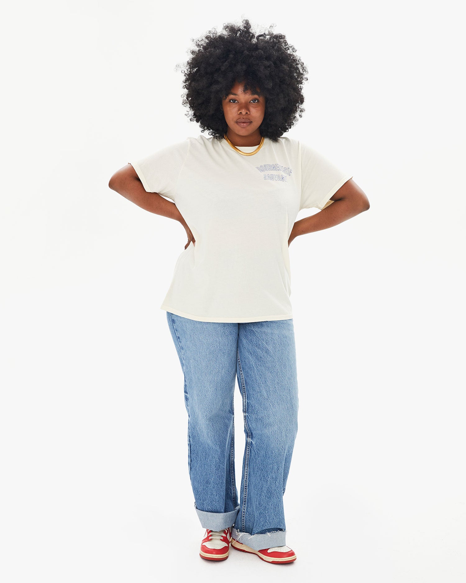 Candice wearing the Cream Bourgouise Sauvage Original Tee with jeans and sneakers