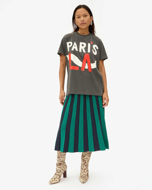 Maly wears the Faded Black Paris L.A. Original Tee with the Heloise Accordion Skirt and Animal Print Boots