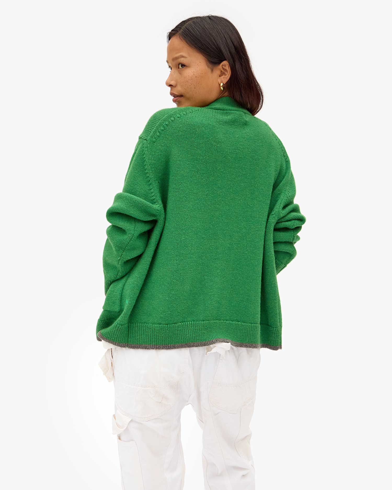 back view of Maly in the Oscar Sweater in Granny Smith