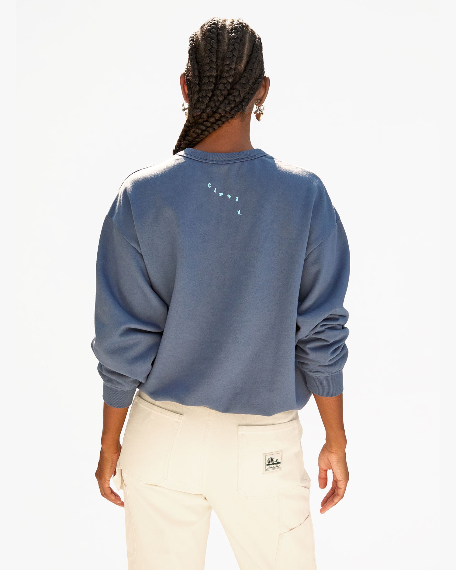 back view of Jordan wearing the faded Navy OUi Oversized Sweatshirt