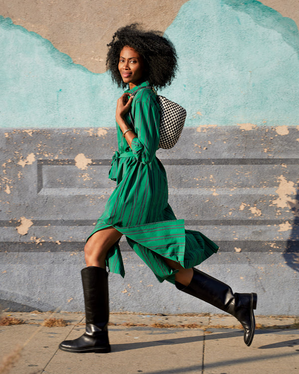 Mecca wearing the Green & Black Stripe Phoebe Dress with the petit moyen on her shoulder