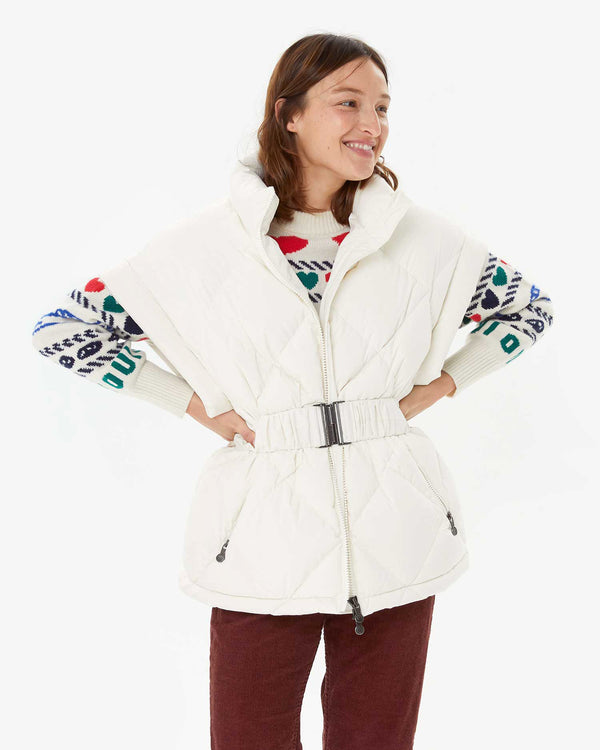 Zoe wearing the Pryenex Diana Vest in Milk over the CV Icon Sweater