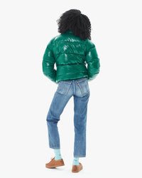 back view of Mecca wearing the Vintage Mythic Puffer Coat in Forest Biome with jeans
