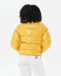 back view of Mecca in the Vintage Mythic Puffer Coat in Yolk