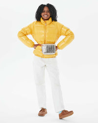 Mecca in the Vintage Mythic Puffer Coat in Yolk with the Silver Metallic Croco fanny pack around her waist