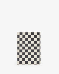 back image of the Black & Cream Checkers Passport Sleeve