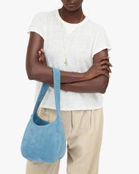 Petit Bando on Mouna's arm