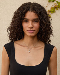 Haro wearing the Sterling Silver Petit Heart Locket on the sterling silver chain necklace