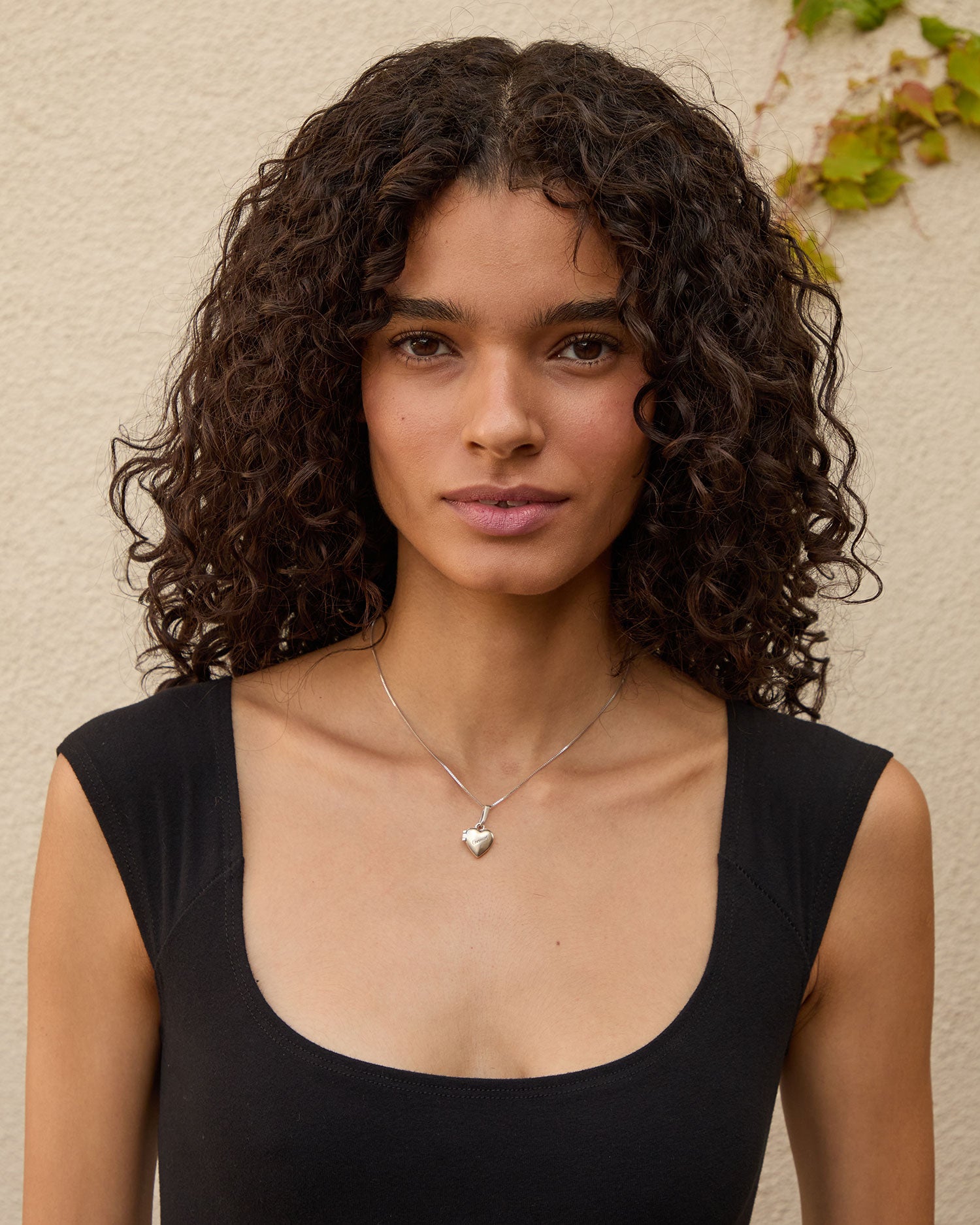 Haro wearing the Sterling Silver Petit Heart Locket on the sterling silver chain necklace