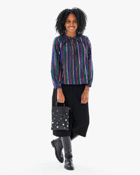 Mecca standing with the Black w/ Stones Petit Mick at her side in the Leonie blouse