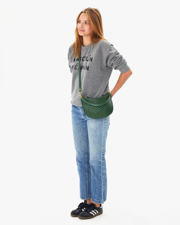 Aurelia wearing the Evergreen Woven Zig-Zag Petit Moyen crossbody over the grey masculine feminine sweatshirt