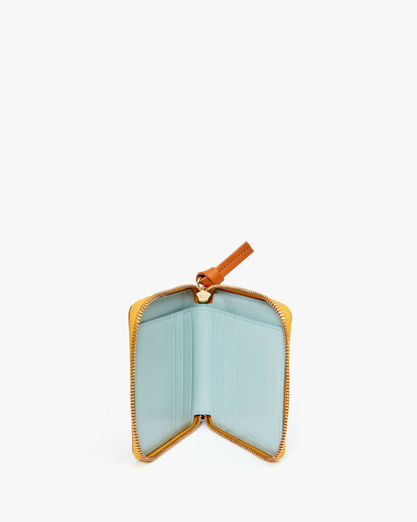 Unzipped Cuoio Autumn Croco Petit ZIp Wallet showing the Aqua colored interior.