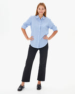 Aurelia wearing the Blue & Cream Stripe Phoebe Blouse with black pants and loafers