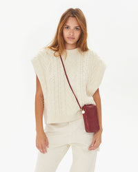 Aurelia wearing the Oxblood w/ Tiger Deboss Poche Sporttif crossbody