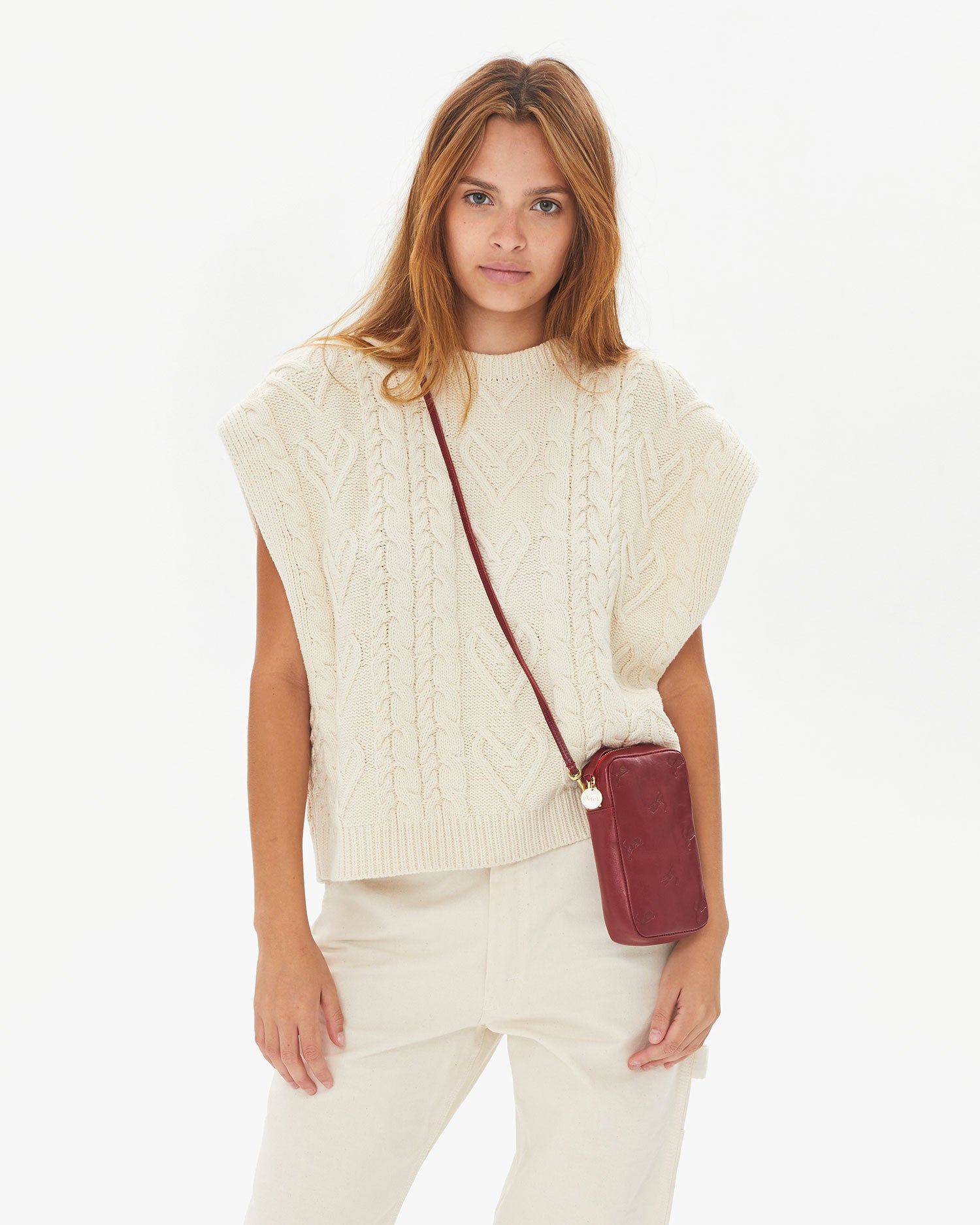 Aurelia wearing the Oxblood w/ Tiger Deboss Poche Sporttif crossbody