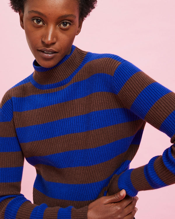 Model wearing the Cobalt & Brown Stripes Ribbed Turtleneck with her hands on her hip