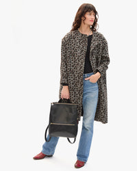 Danica holding Remi Backpack