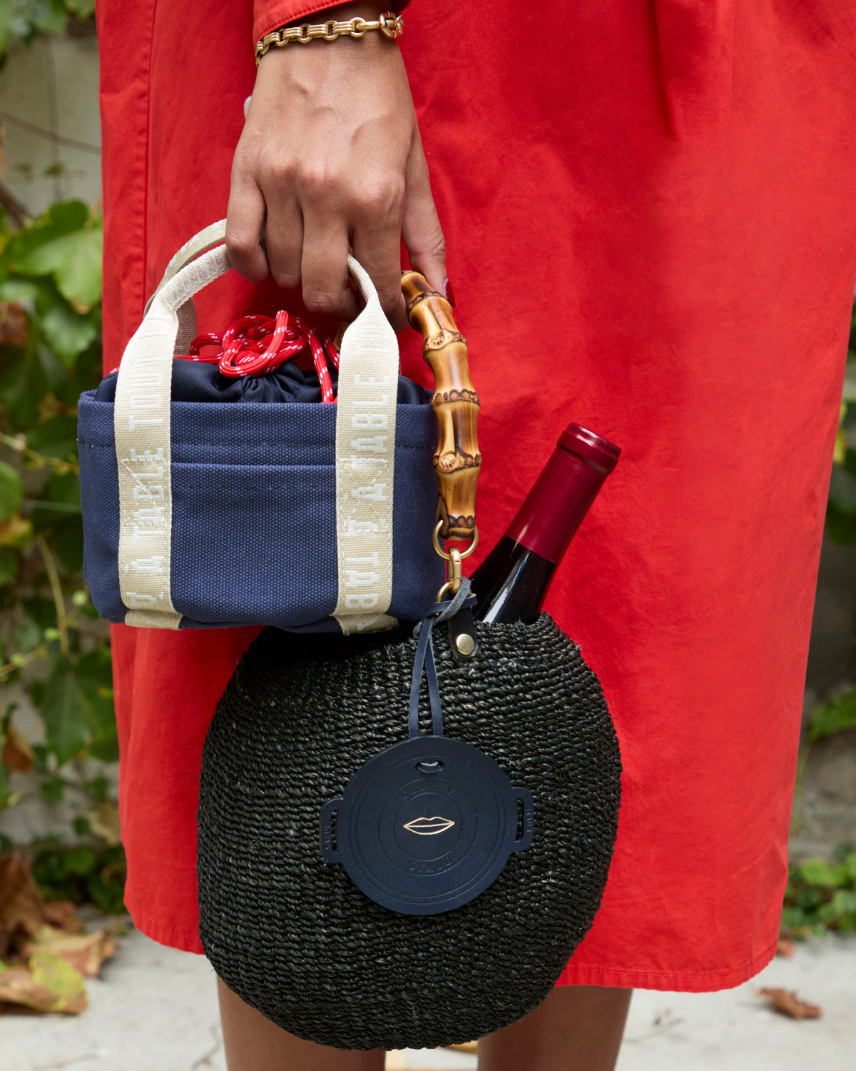 Model carrying the Clare V. x Staub Petit Dutch Tote. 