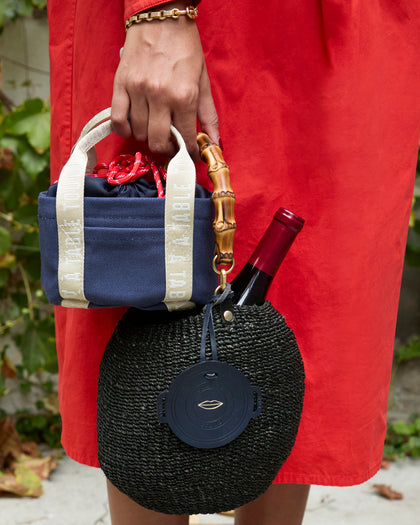Model carrying the Clare V. x Staub Petit Dutch Tote. 