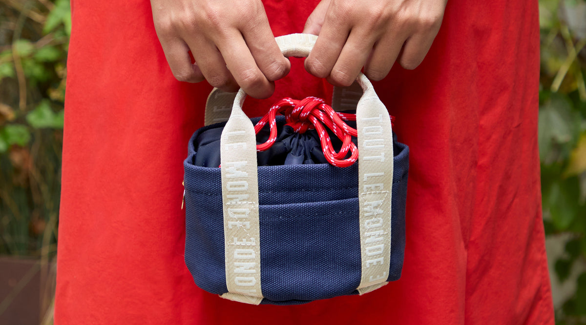 Close-Up of model carrying the Clare V. x Staub Le Petit Dutch Tote. 