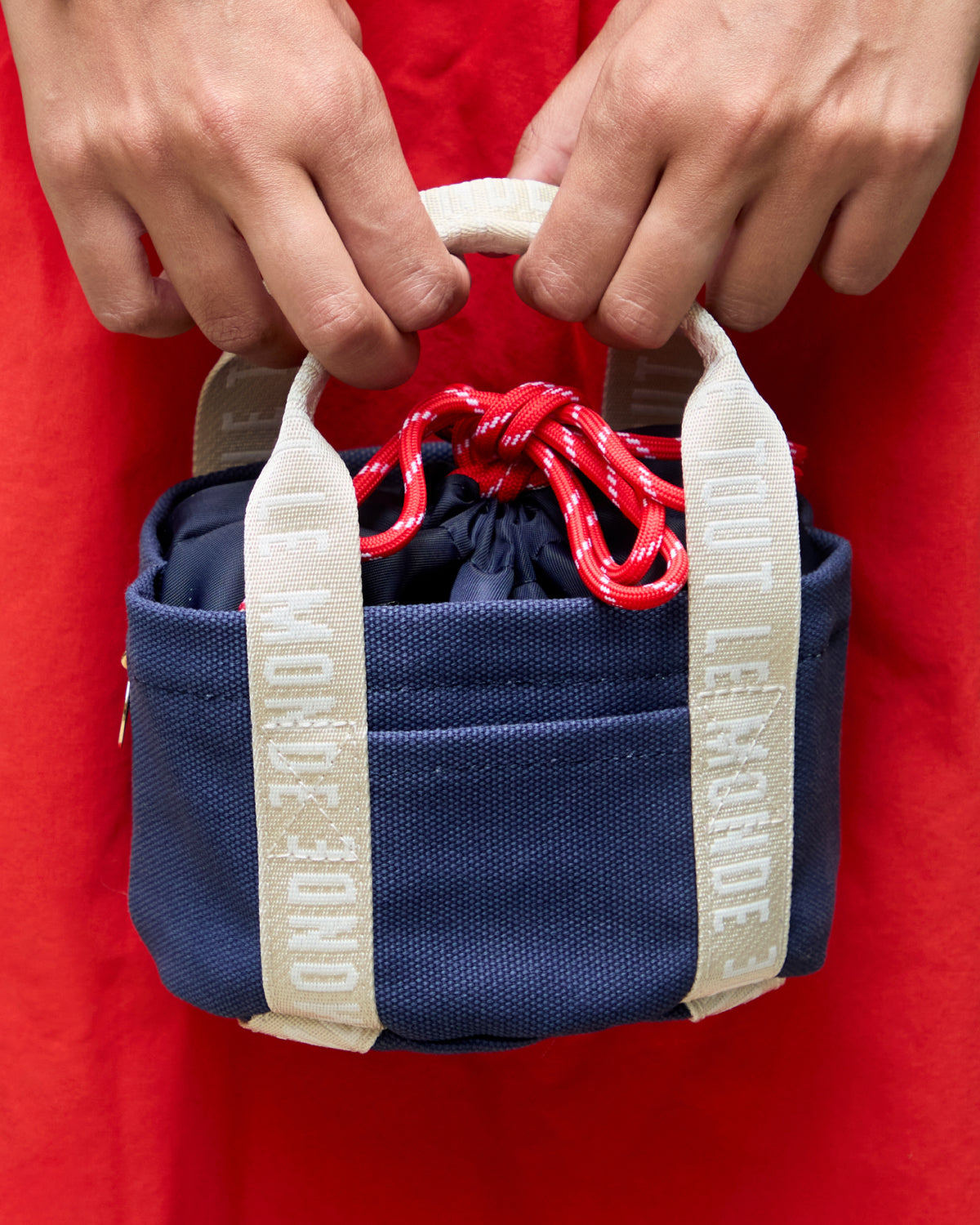 Close-Up of model carrying the Clare V. x Staub Le Petit Dutch Tote. 
