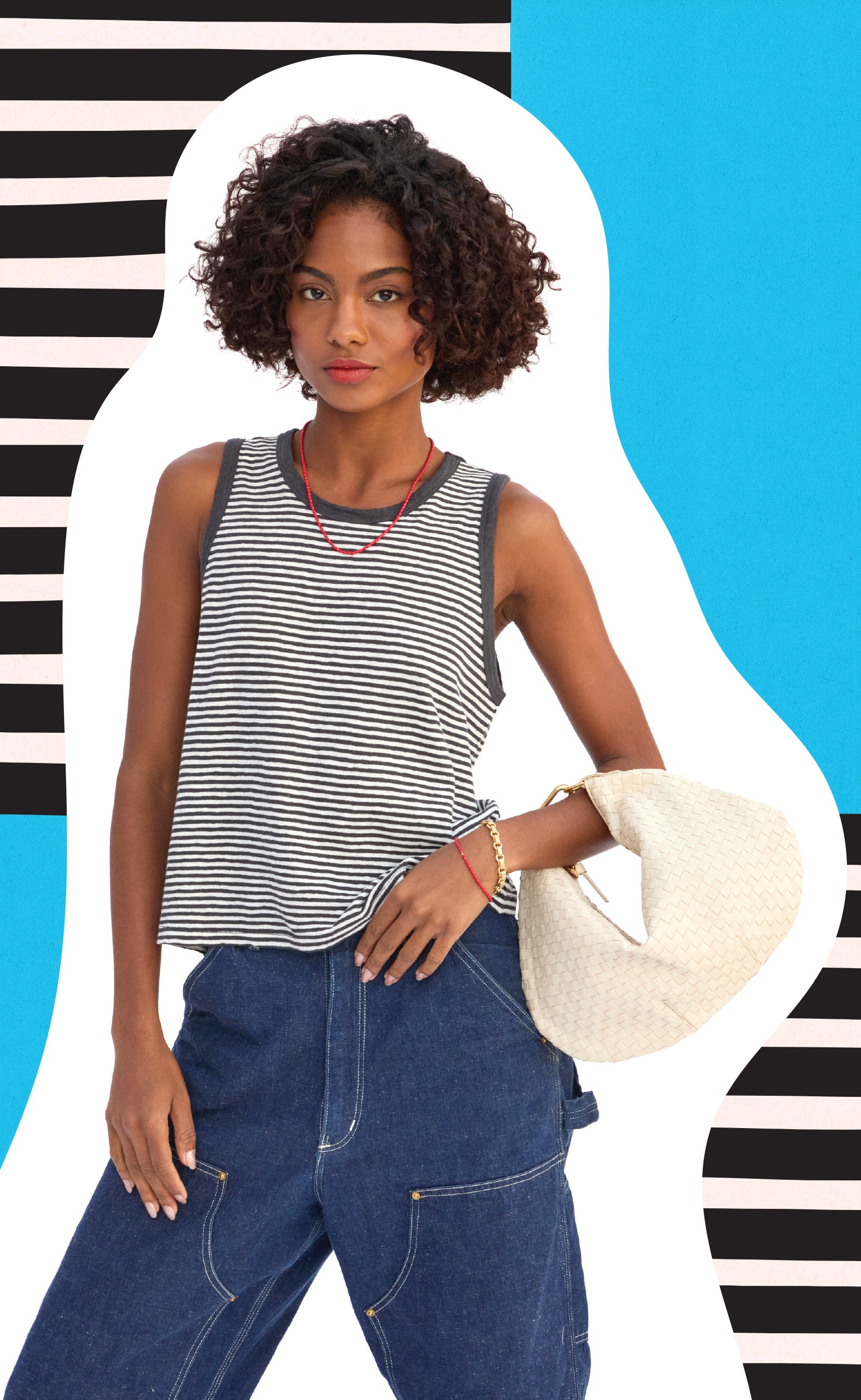 Model wearing the Black and Cream Mini Stripe Camp Fit Tank and carrying the Cream Petit Moyen with Top Handle Bébé.