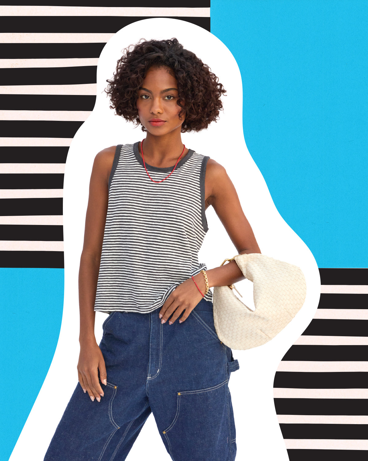 Model wearing the Black and Cream Mini Stripe Camp Fit Tank and carrying the Cream Petit Moyen with Top Handle Bébé.