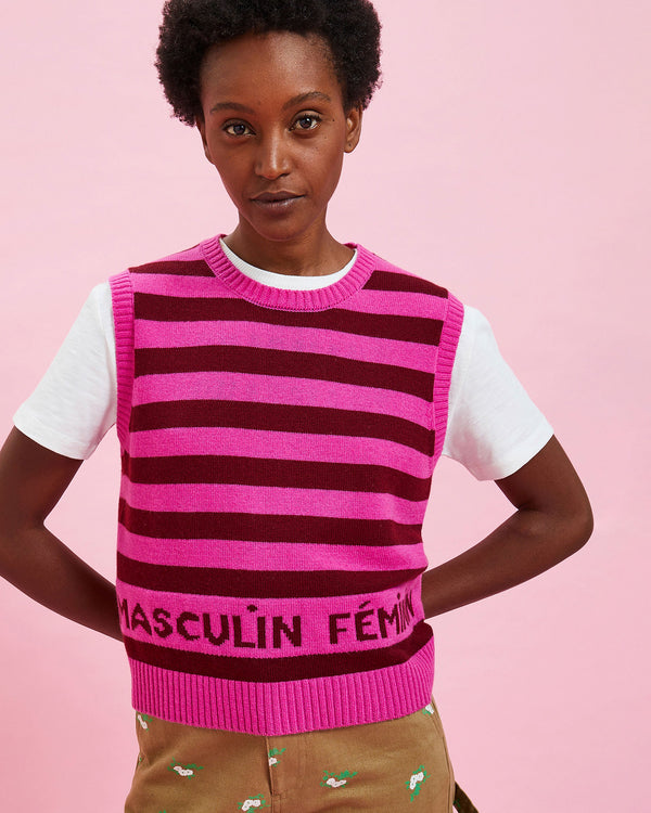 Model wearing the Neon Pink & Oxblood Stripes sweater vest over a white tee shirt