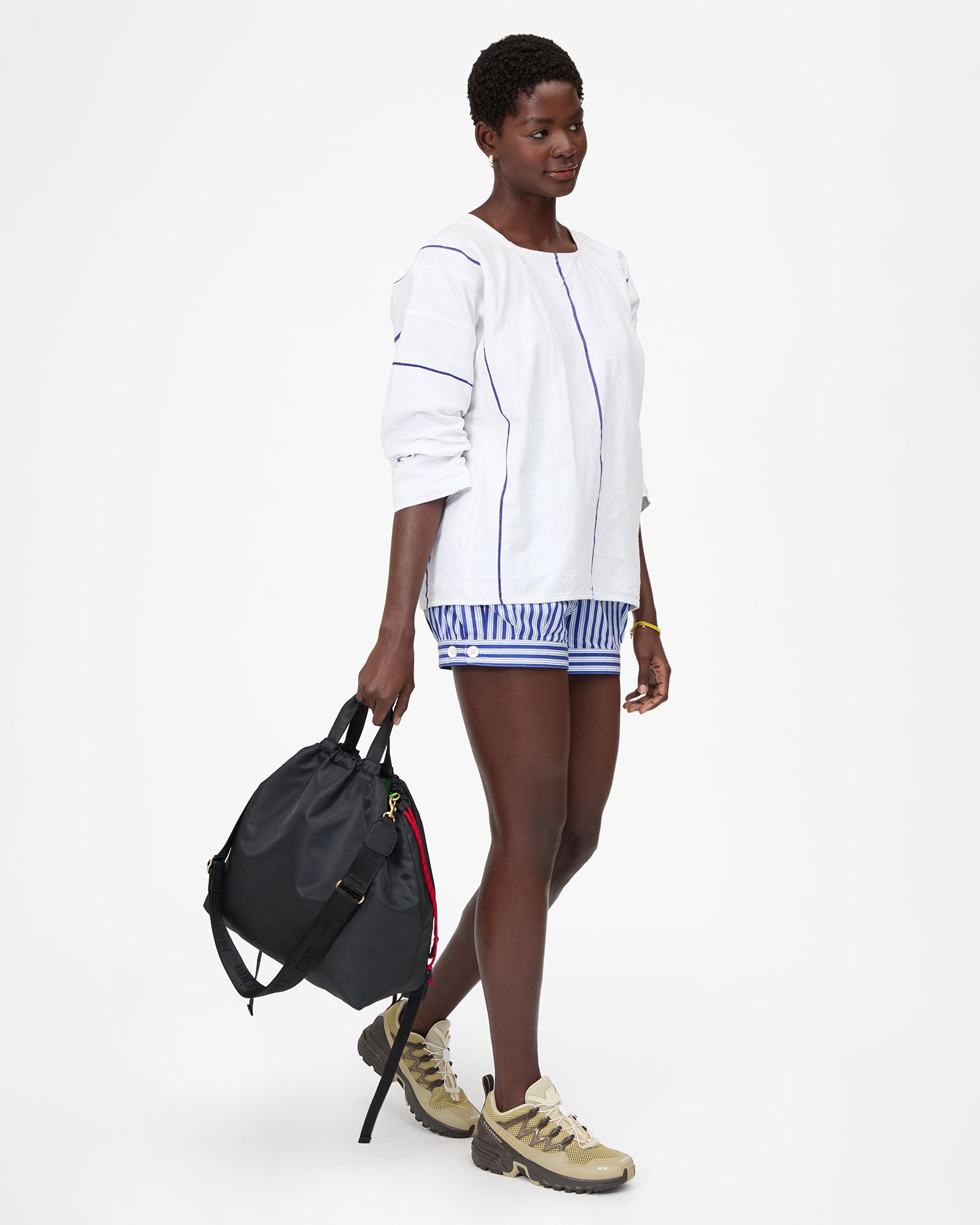 Mouna holding Sac Tout Backpack