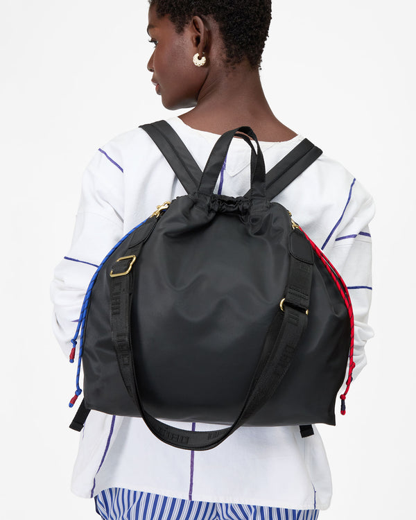 Mouna wearing Sac Tout Backpack