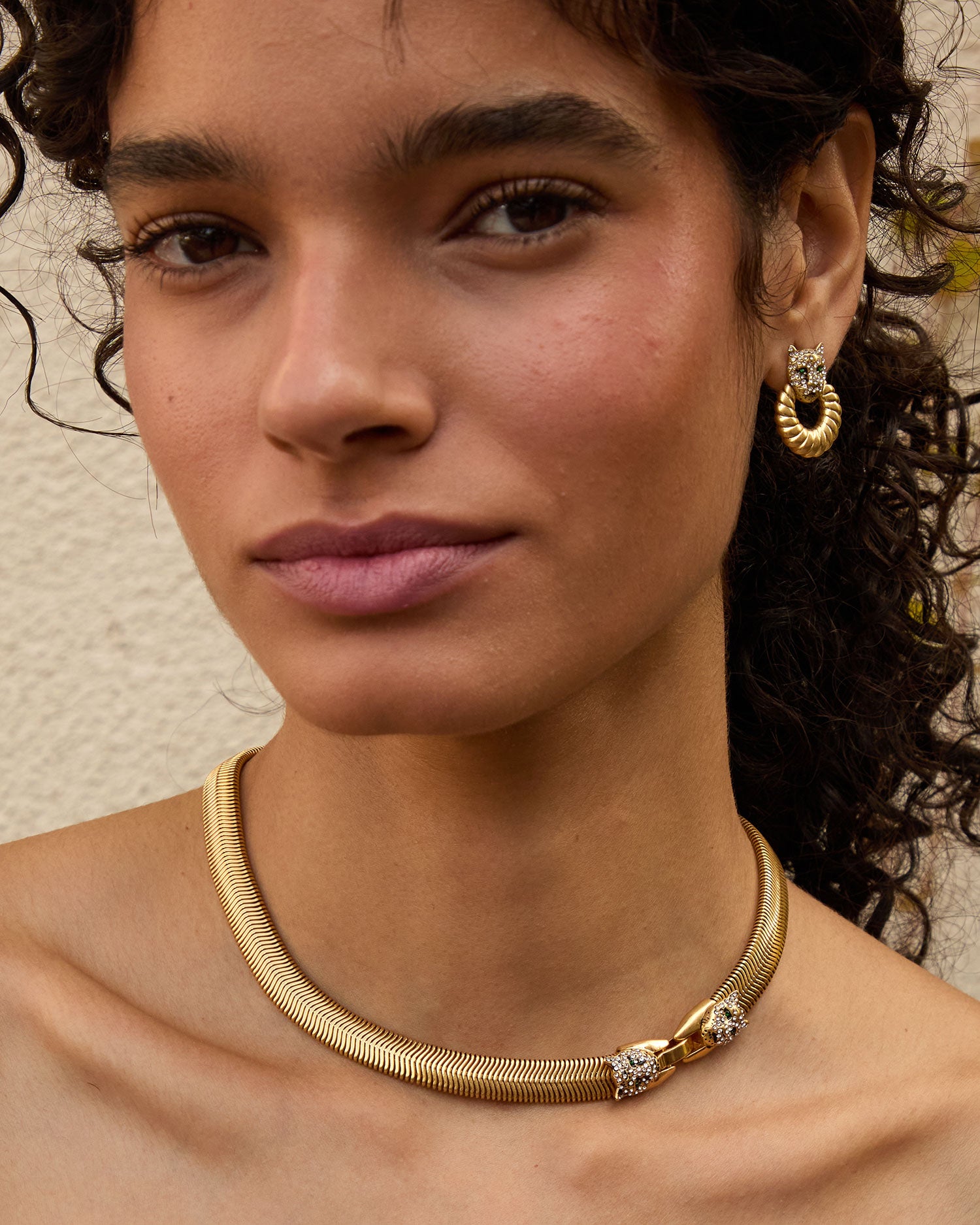 Haro wearing thre Vintage Gold Snake Chain Collar with the doorknocker earrings