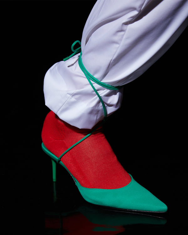 model wearing the Cherry Original Socks with green shoes