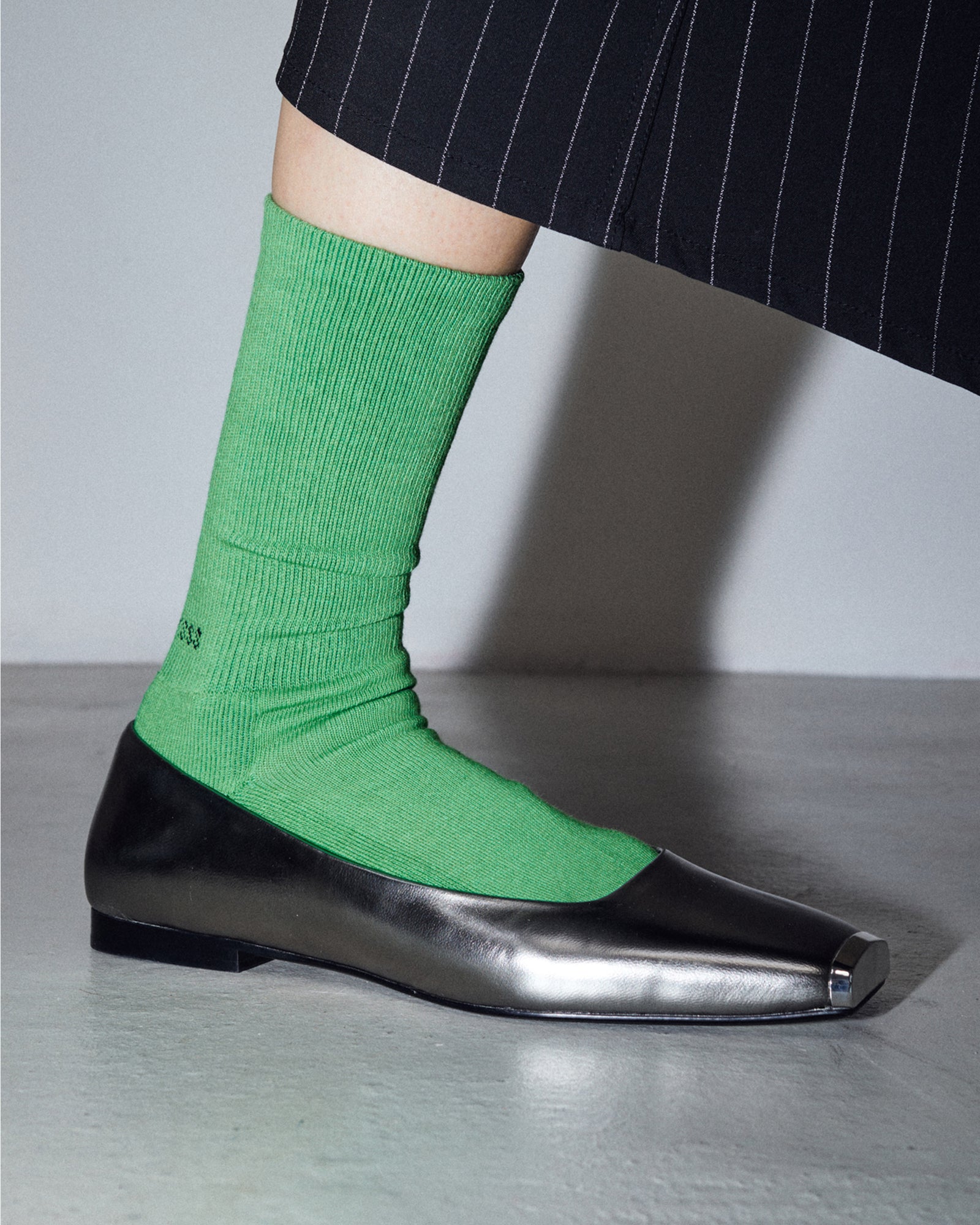 model wearing the Apple Bottom Original Socks with silver shoes