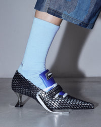 Model wearing the Original Socks in the color Good  with silver shoes